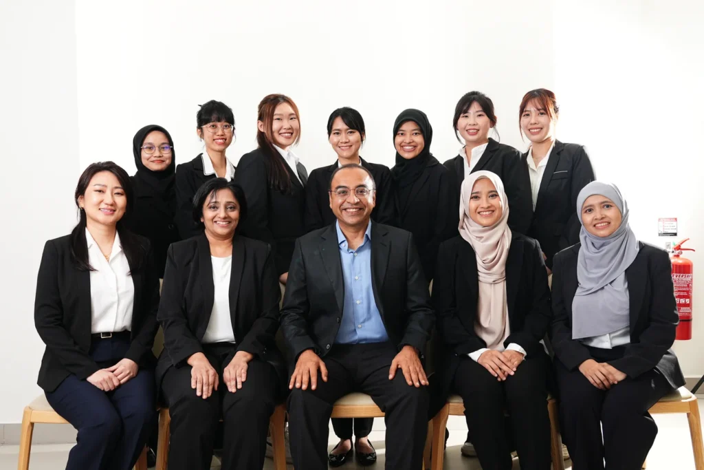 The clinical and support team of KL Eye Specialist Centre (Klang), seated and standing together